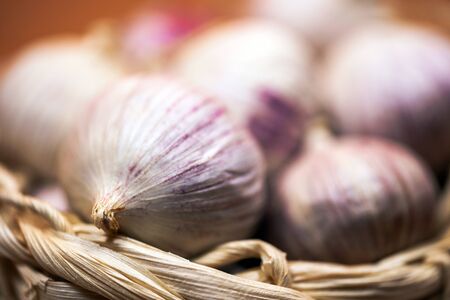 Garlic in a basket, garlic close-up. Dried French garlic.の写真素材