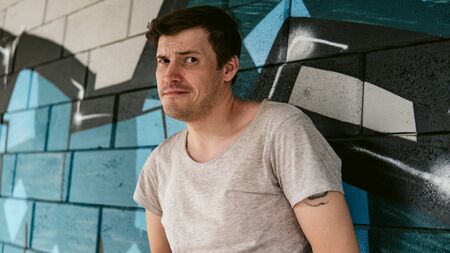 Street portrait of a man in everyday clothesの写真素材