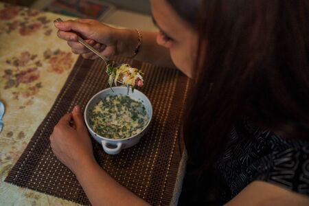 Cold soup name - okroshka, the national dish of the cuisine of Russia and Ukraine. Cold soup with fresh cucumbers, radishes, potato and sausage with yoghurt in bowl.の写真素材
