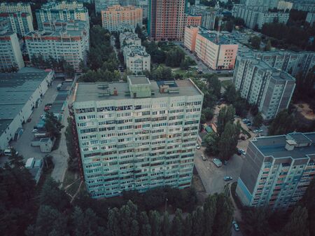 Drone view of new building complex in city center with housesの写真素材