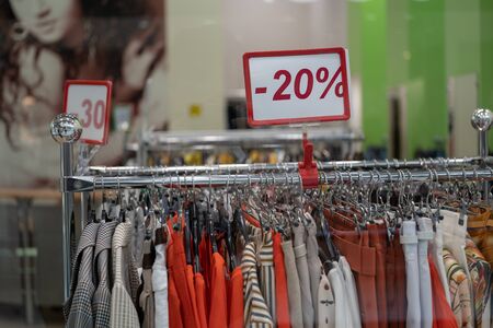 Season sale, black friday and shopping concept. Sale signs on stands in shopの写真素材