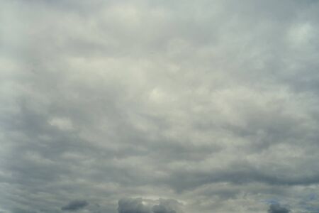 Stormy clouds background. Dramatic stormy sky with dark heavy clouds.