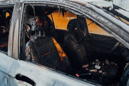 Vandalism or revenge, burnt car. The consequences of popular protest, burnt car, a crime.の写真素材
