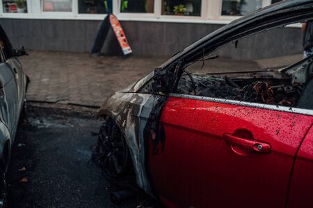 Vandalism or revenge, burnt car. The consequences of popular protest, burnt car, a crime.の写真素材