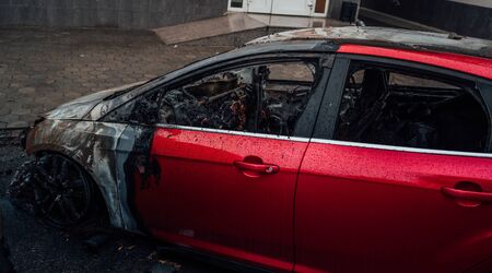 Vandalism or revenge, burnt car. The consequences of popular protest, burnt car, a crime.の写真素材