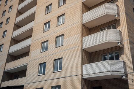 Modern apartment buildings on a sunny day with a blue sky. Facade of a modern apartment buildingの写真素材