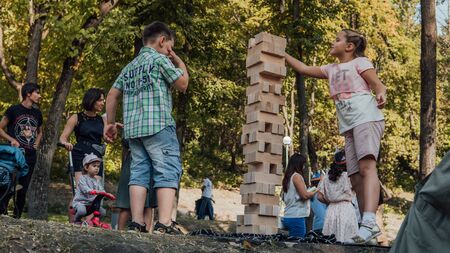 Kids playing in the Park playing Jengaのeditorial素材