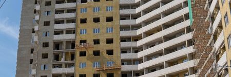 Construction, building under construction. The house is under construction