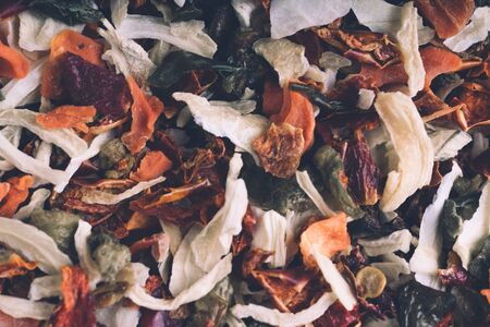 Dried vegetables texture. Texture background. Green spice mix dried vegetables and herbs. Spices consist paprika garlic onion parsnip celery coriander oregano pepper rosemaryの写真素材