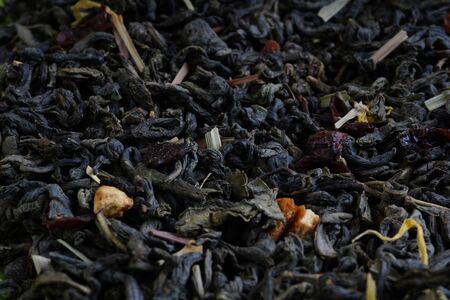 Macro texture background of dried, raw white tea leaves frame filling flat lay from above.の写真素材