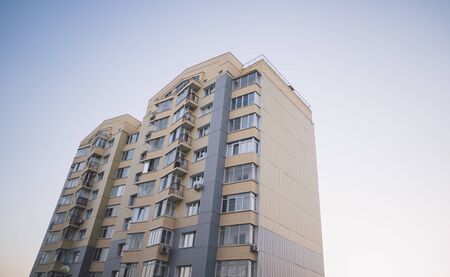 Modern apartment buildings on a sunny day with a blue sky. Facade of a modern apartment buildingの写真素材