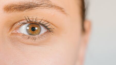 Macro image of human eye with contact lens. Woman's eye close-up.