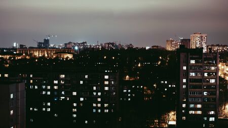 Modern apartment buildings, at night. The facade of a modern residential building.の写真素材