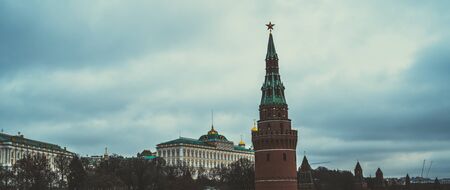 The tower of the Moscow Kremlin against the gray sky