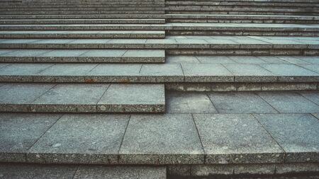 Stone staircase in centre of city. Outdoor stone steps background texture made of multitude slab.の写真素材