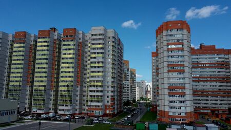 Modern apartment buildings on a sunny day with a blue sky. Facade of a modern apartment buildingの写真素材