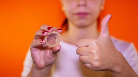 Protection against AIDS and birth control, color backgroundの写真素材