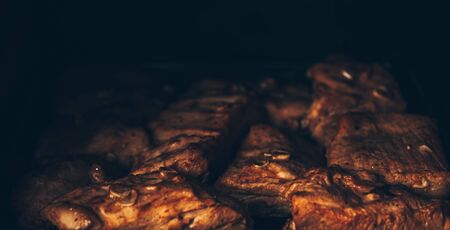 Seasoned meat with garlic fried in oven.の写真素材