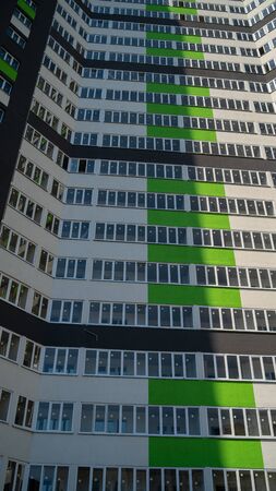 Modern beautiful new buildings. Colored wall, Modern apartment buildings on a sunny day. Facade of a modern apartment building. residential building modern apartment condominium architecture.の写真素材