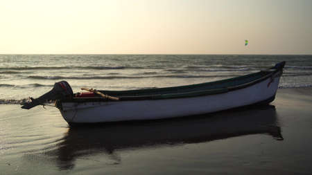 The old boat by the sea against the sunset