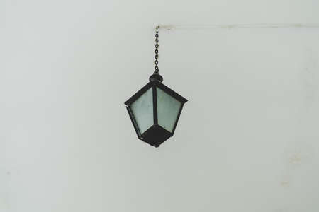 Old hanging light in room.