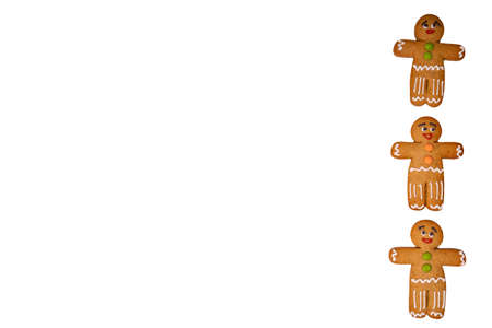 Close up of gingerbread men on isolated white background. Festive decorative gingerbreads for...