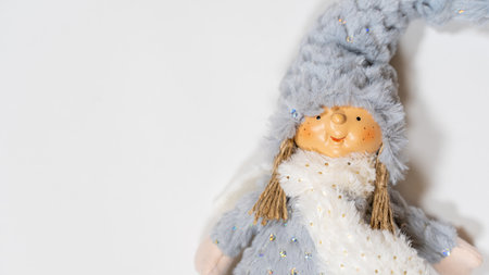 Close up of cute doll on white background. Portrait of attractive puppet with copyspace for your textの写真素材