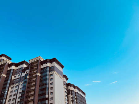 Modern apartment building on a sunny day with a blue sky. Facade of a modern apartment building....