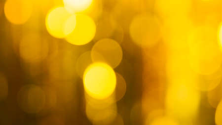 Abstract bokeh background. Abstract background of bright yellow and blue lights in soft focus.の写真素材
