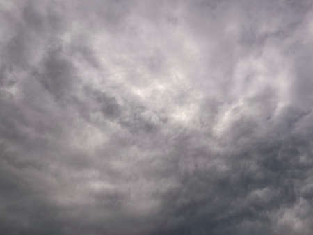 Cloudy sky with clouds. Low angle of bright blue sky with clouds.