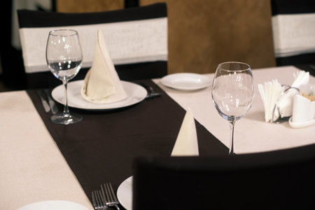 Banquet table with wine glasses. High angle elegant banquet table served for wedding celebration.の写真素材