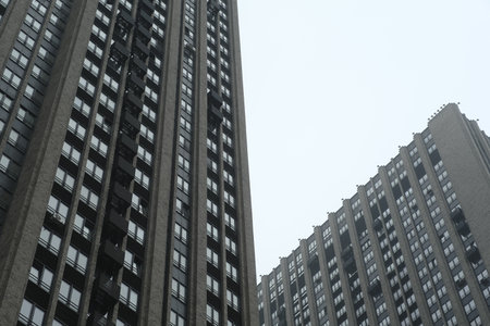 Facade of modern architecture residential building in cloudy weather. Contemporary high-rise building exteriorの写真素材