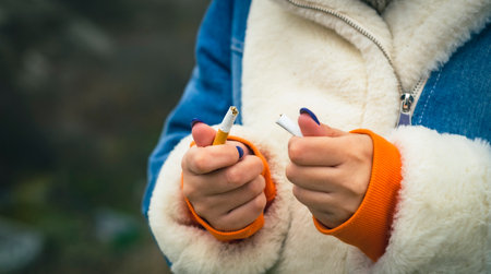 Crop woman breaking cigarette and quitting smoking. Closeup of crop woman splitting cigarette for idea of stop smoking.の写真素材