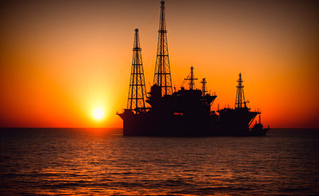 Oil drilling rig on the sea at sunset. oil and gas industry.の素材