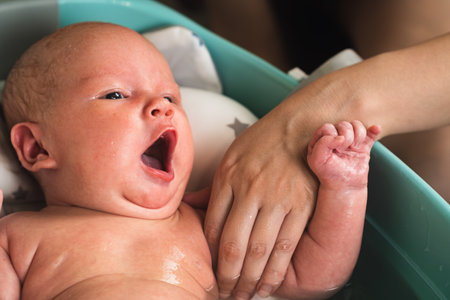 A newborn baby takes a bath. A lovely child is undergoing military training for the first time. The...