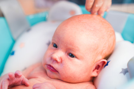 A newborn baby takes a bath. A lovely child is undergoing military training for the first time. The...