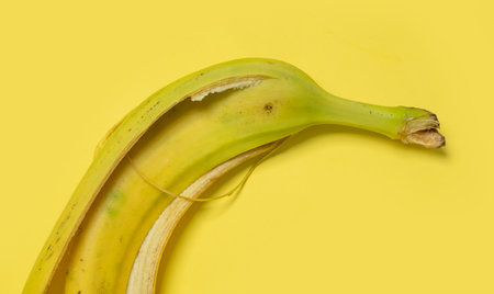 Banana peel on a yellow background. Close-up, macroの写真素材