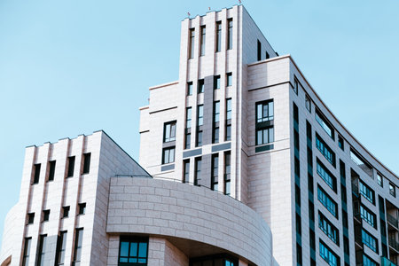 Modern Architectural Design of a Commercial Building Against a Clear Blue Sky