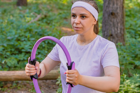 A Sunny Day Workout in the Woods With a Resistance Ring.の写真素材