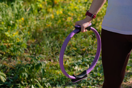 A Sunny Day Workout in the Woods With a Resistance Ring.の写真素材