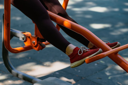 Woman Working Out on Outdoor Exercise Equipment in the Park.