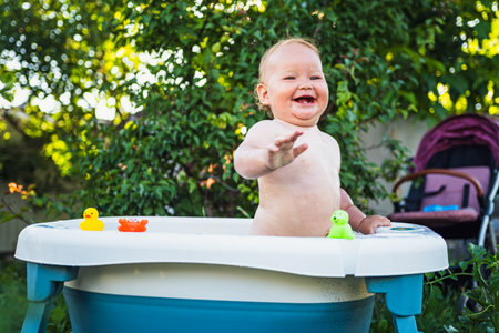 A Baby's Delightful Bubble Bath Adventure in the Summer Sun.