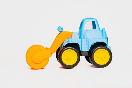 Colorful toy roller truck for imaginative play on a bright surface