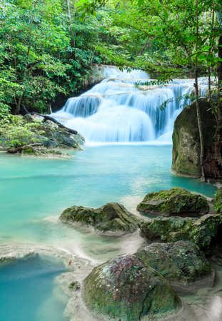 Deep forest waterfall at Erawan waterfall National Park Kanjanaburi Thailandの写真素材