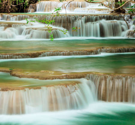 Deep forest waterfall at Erawan waterfall National Park Kanjanaburi Thailandの写真素材