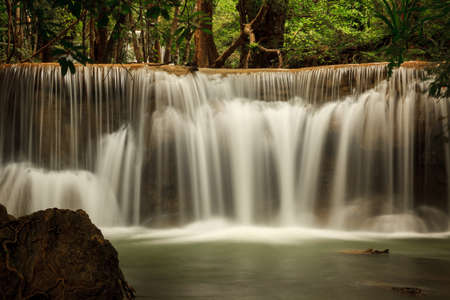 Deep forest waterfall at Huay Mae Kamin waterfall National Park Kanjanaburi Thailandの写真素材