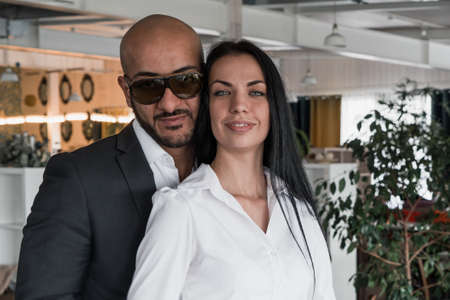 Portrait of an Arab businessman with a girl in the restaurantの写真素材