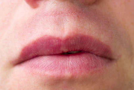 Chubby beautiful mens lips. Chapped lips. Close-up