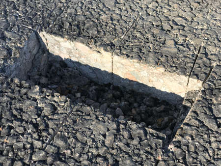 Place of sampling the asphalt coating in the form of a rectangular from asphalt concrete pavement. Kern. Close-upの写真素材