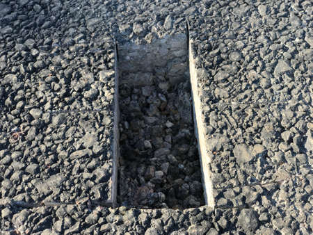 Place of selection of the kernel in the form of a rectangular from asphalt concrete pavement. Kern. Close-upの写真素材